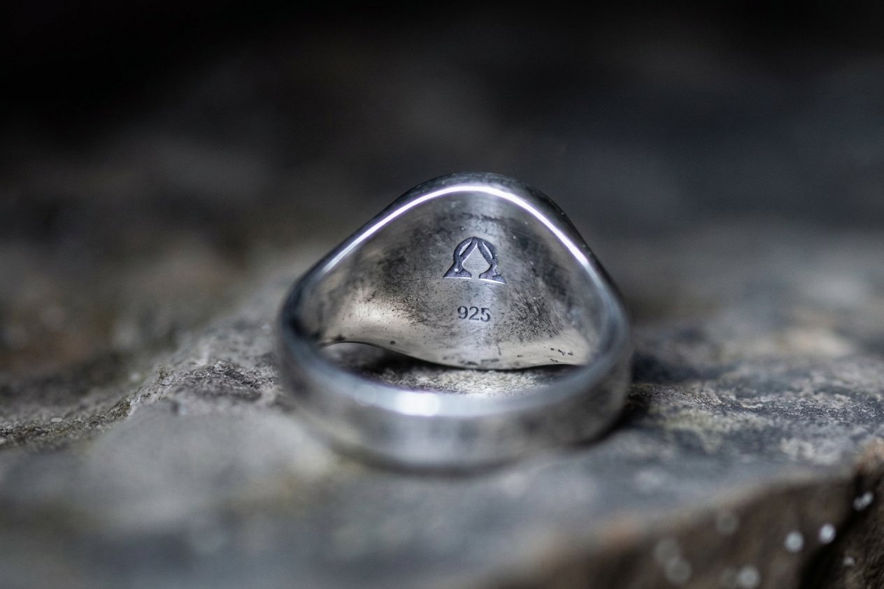 Interior of a sterling silver signet ring showing the maker's mark and 925 purity stamp — DARMA